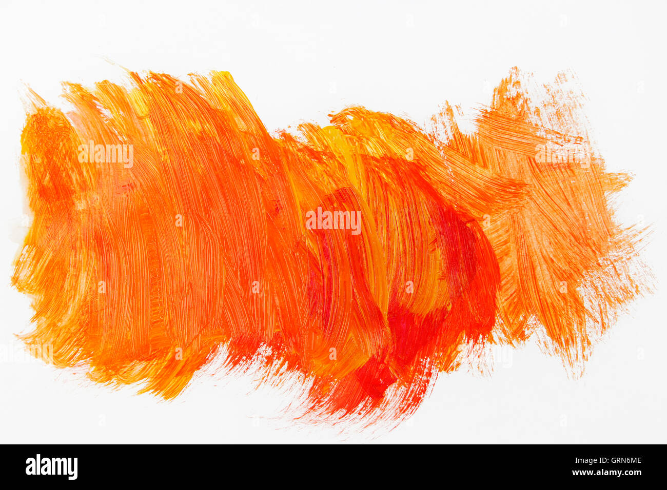 Pintura naranja sobre fondo liso Foto de stock