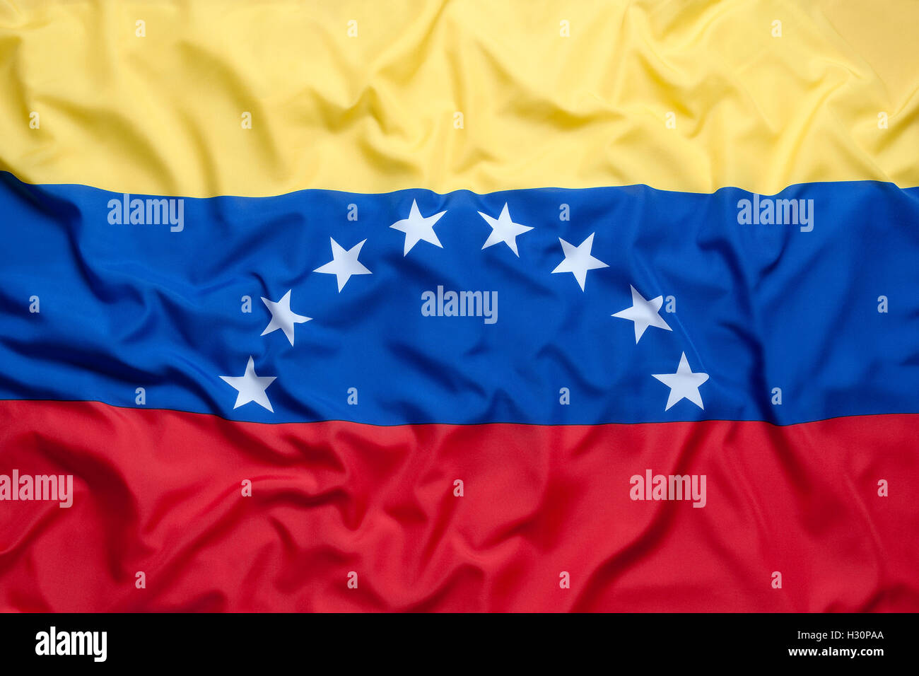 Bandera textil de Venezuela en el fondo Foto de stock