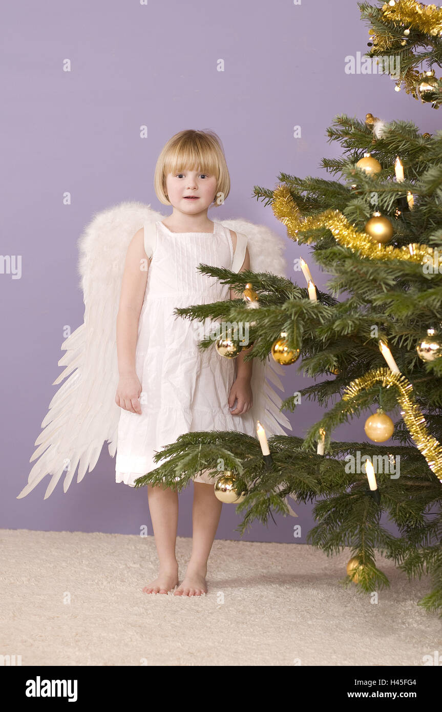 Las niñas, las alas del ángel, vestuario, árbol de Navidad Fotografía de  stock - Alamy