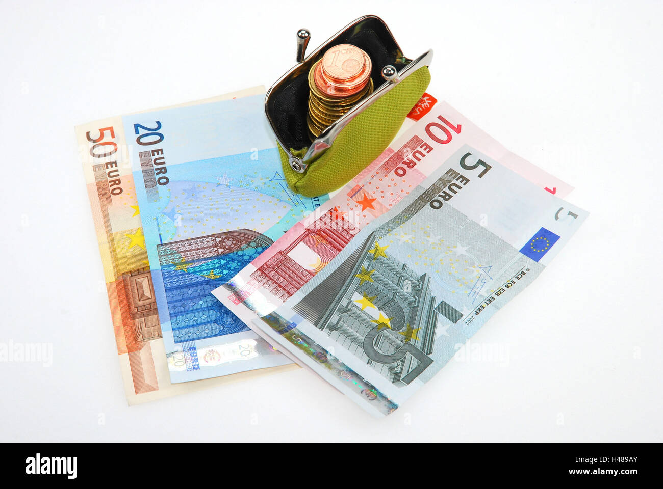Monedero con monedas y billetes de banco, Foto de stock