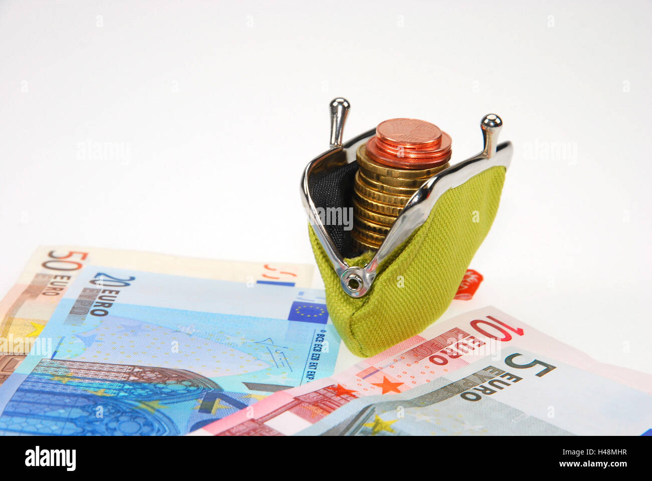 Monedero con monedas y billetes de banco, Foto de stock