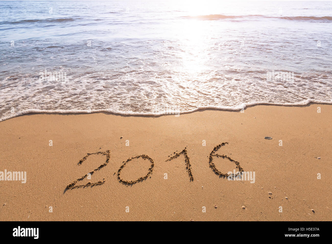 2016 Escribe sobre una playa de arena con sol brillante Foto de stock