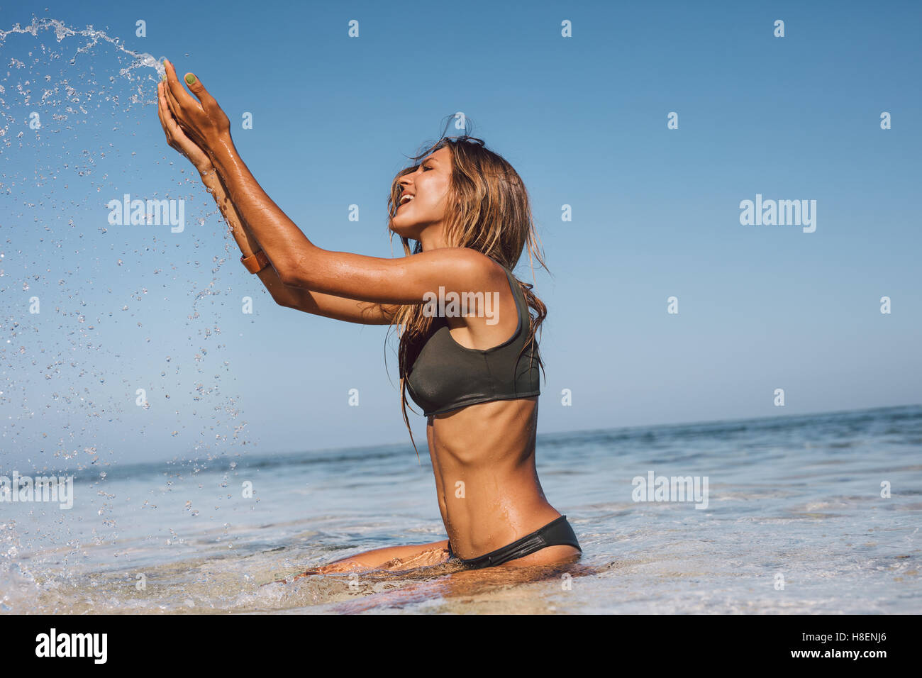 Beautiful girl in bikini playing fotografías e imágenes de alta resolución  - Alamy