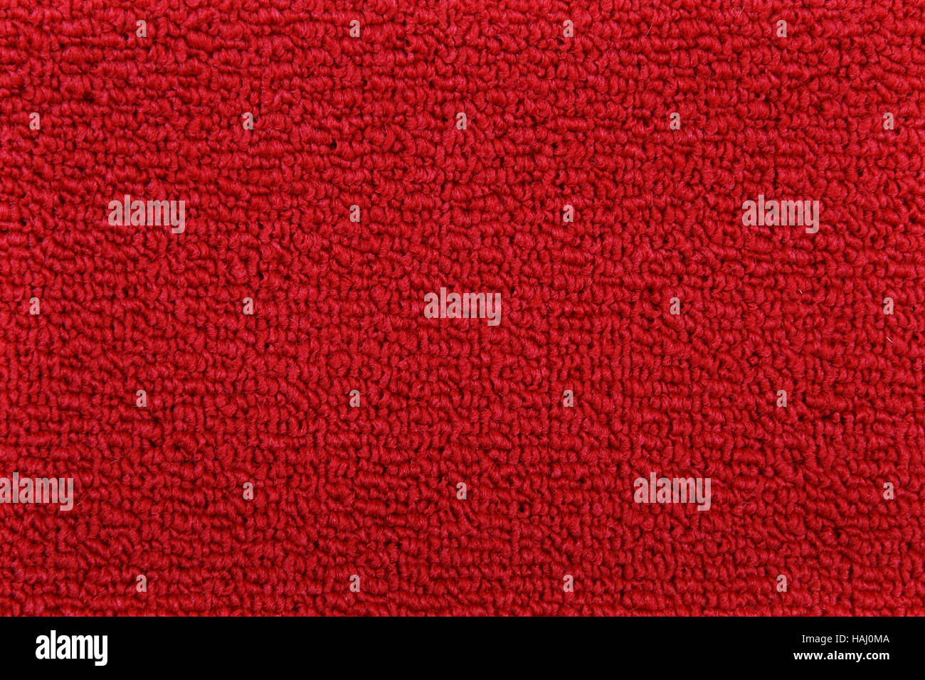 Textura de la alfombra roja Foto de stock