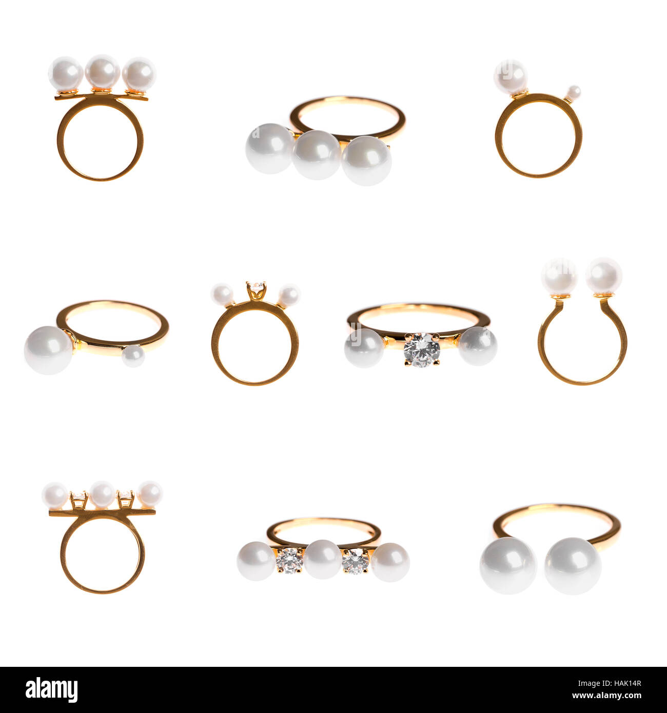 Colección de anillos Perla Dorada aislado en blanco Foto de stock