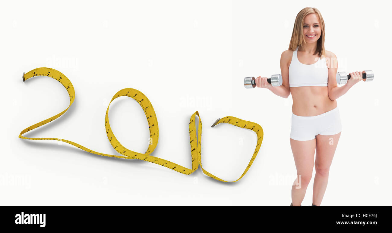 Imagen compuesta de retrato de mujer joven el ejercicio con pesas Foto de stock