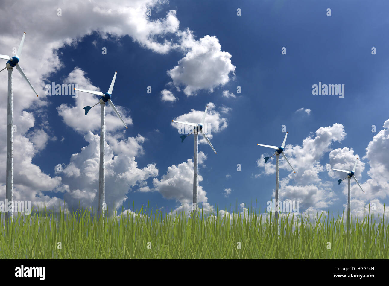 Turbinas de viento y el pasto verde sobre fondo de cielo azul, concepto de energía alternativa para reducir el calentamiento global. Foto de stock