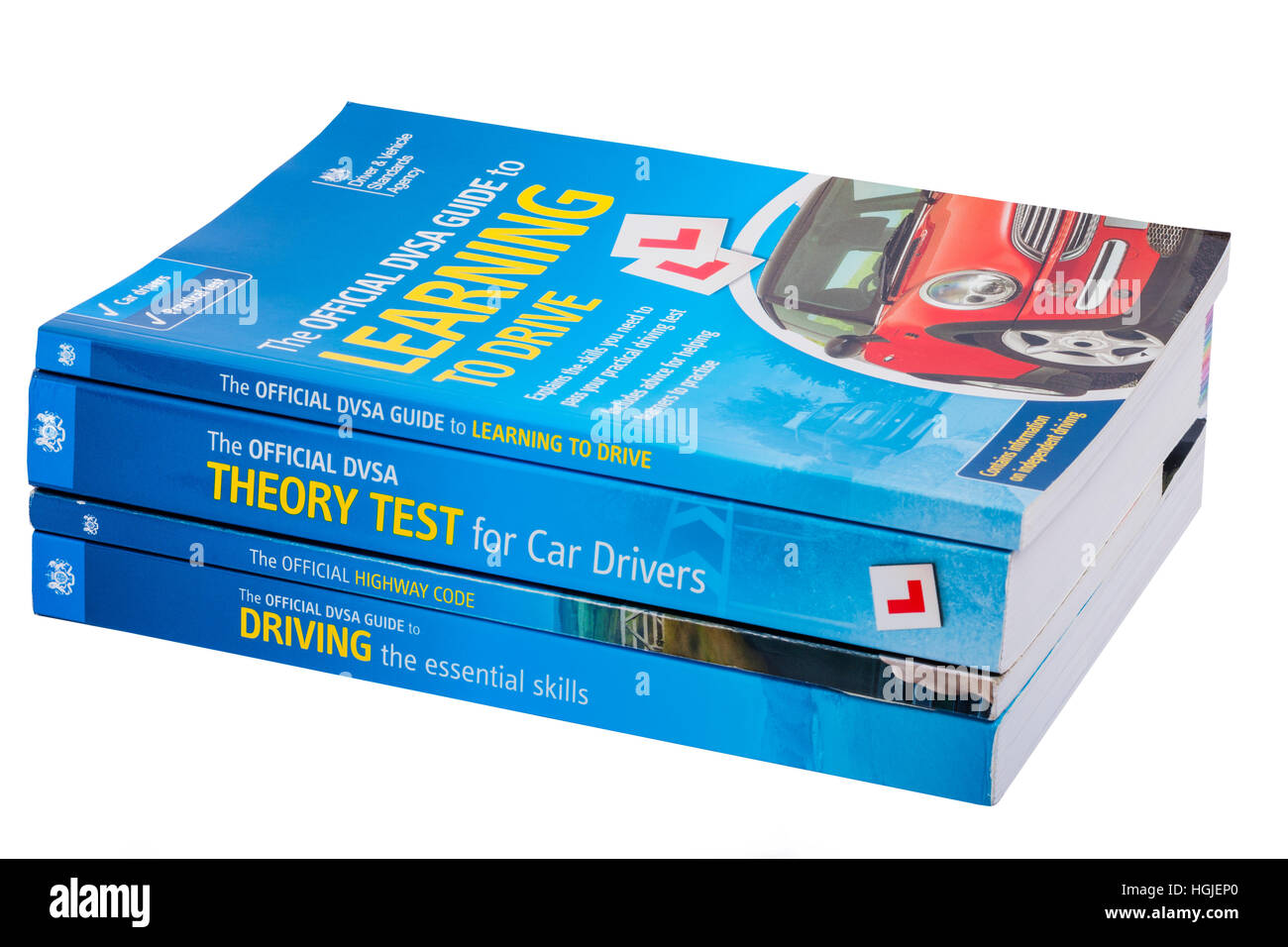 Aprender a conducir variados libros sobre un fondo blanco. Foto de stock
