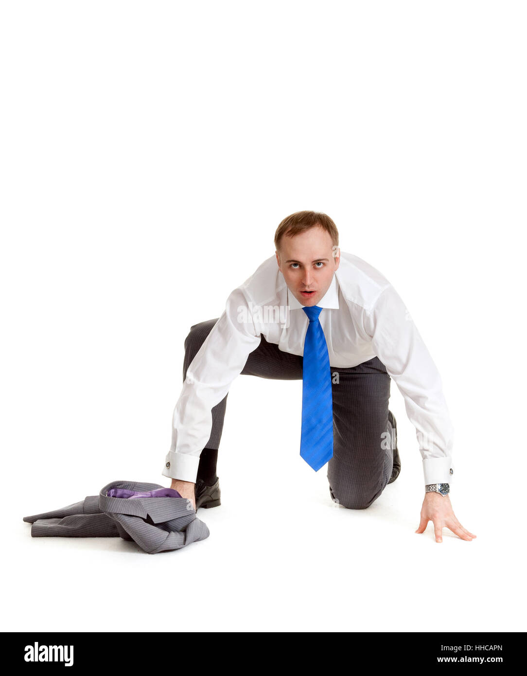 Hombre de traje gris y corbata azul se prepara para ejecutar Fotografía de  stock - Alamy