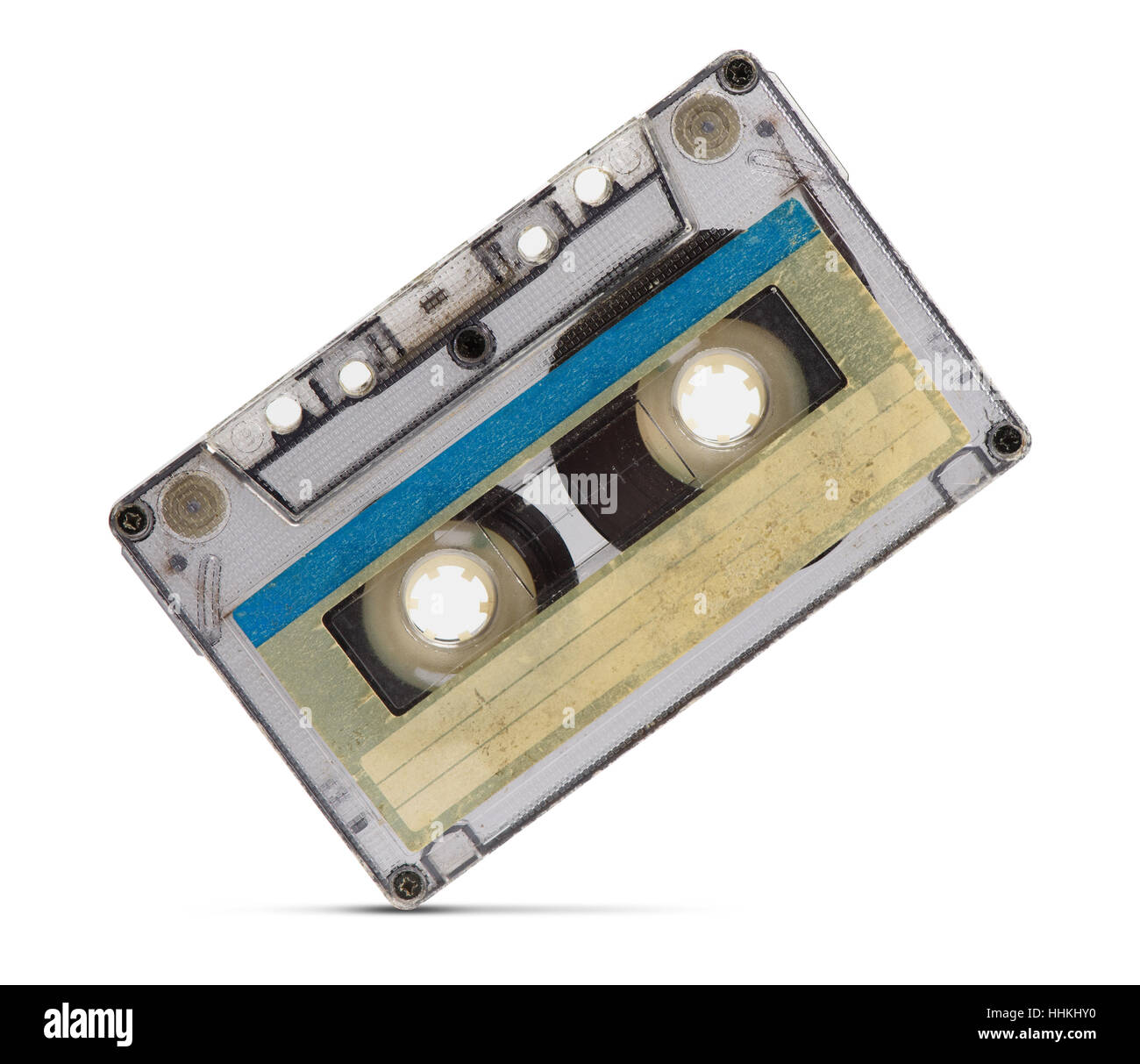 Cerca de una cinta de audio vintage sobre fondo blanco. Foto de stock