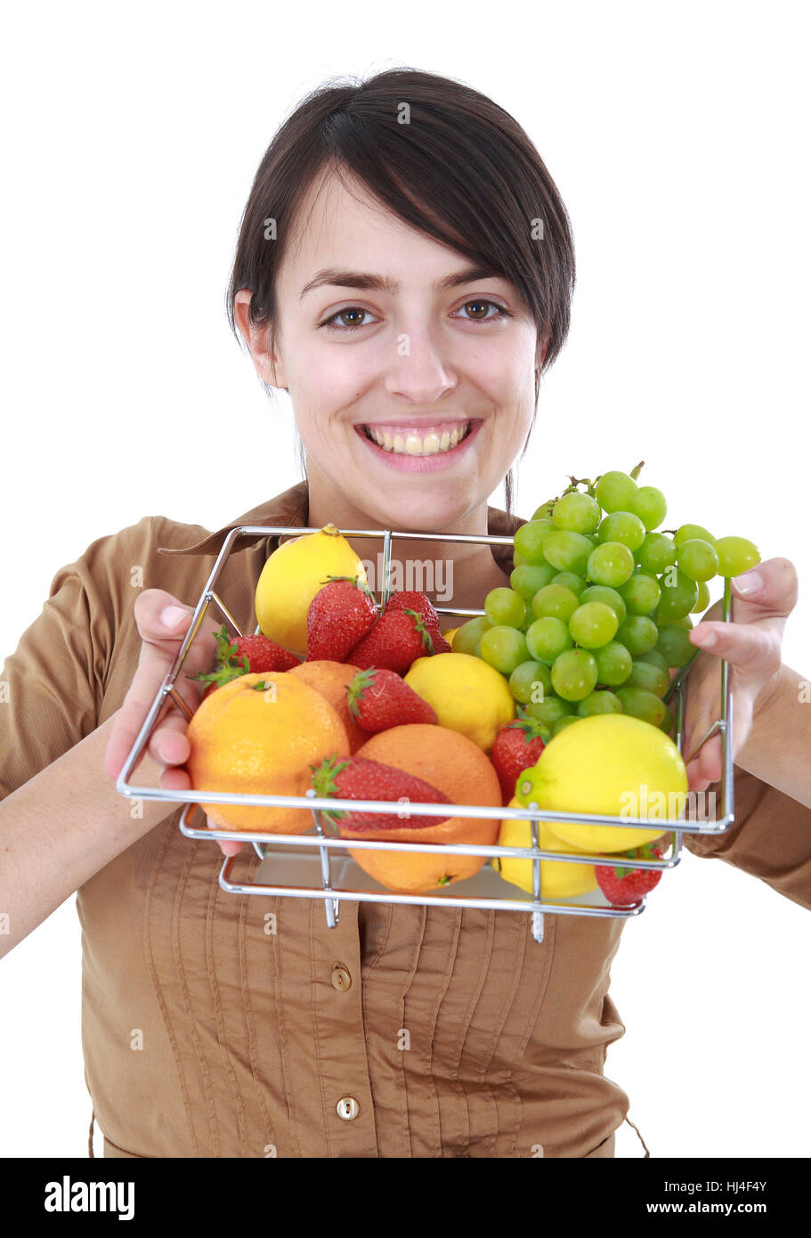 Mujer joven con una fruta Foto de stock
