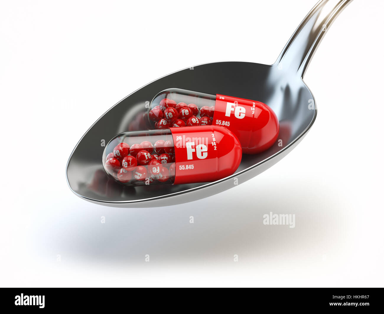 Las píldoras con hierro Fe ferrum elemento en la cuchara. Los suplementos  dietéticos. Cápsulas de vitamina. Ilustración 3d Fotografía de stock - Alamy