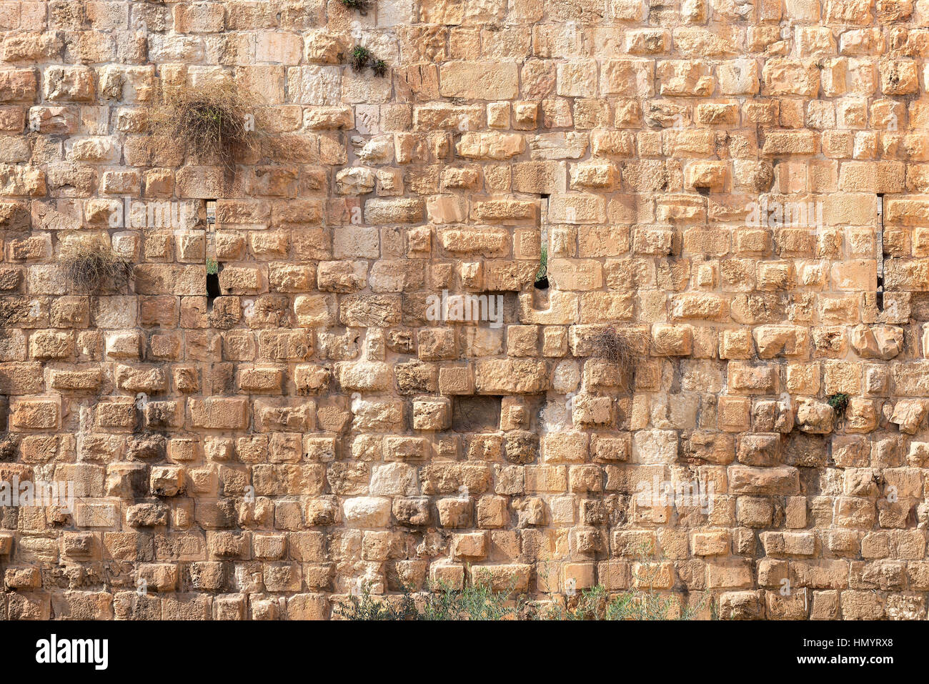 Fondo de muro de piedra en la Ciudad Vieja de Jerusalén, Israel. Foto de stock