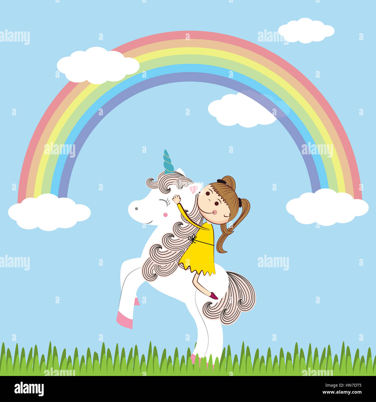 La pequeña niña y su dulce unicornio. Foto de stock