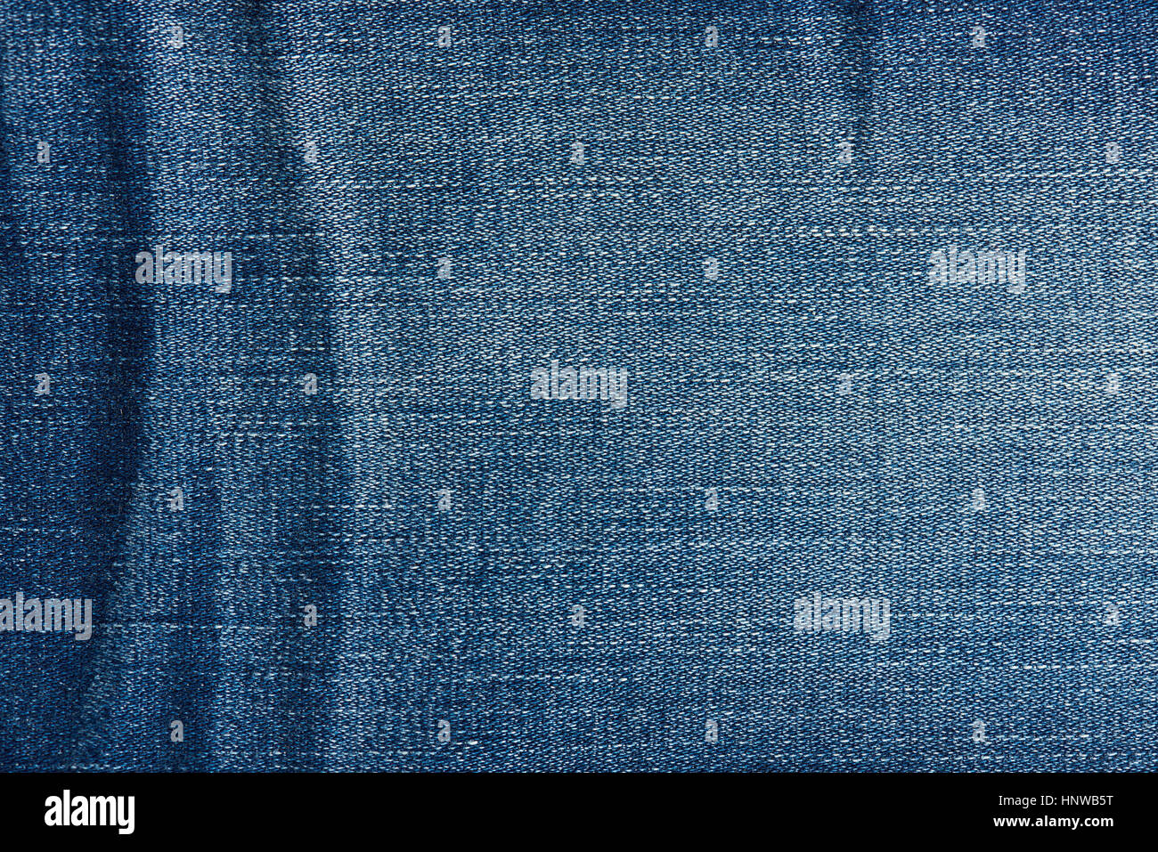 Blue jeans antecedentes cerca de líneas textiles Foto de stock