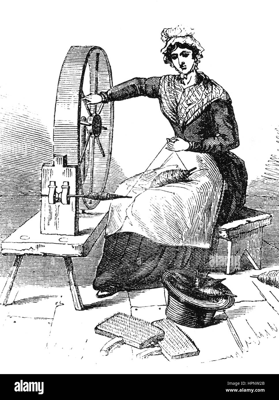 JERSEYWHEEL utilizado para hilar el algodón y la lana, y sustituido por las máquinas como el spinning jenny durante la revolución industrial. Grabado alrededor de 1800 Foto de stock