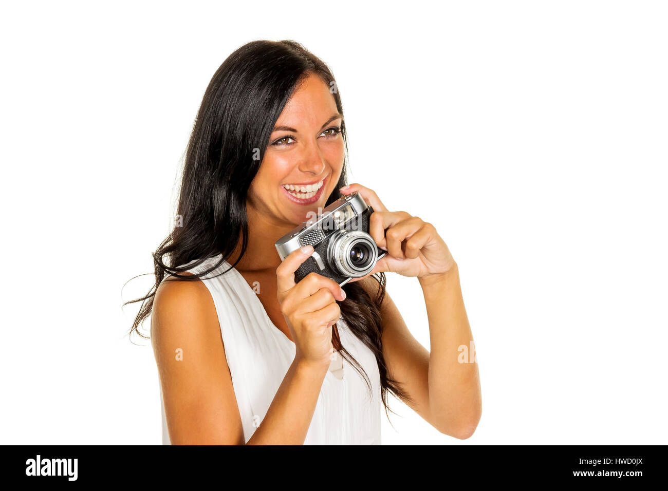 Una joven toma una foto de la cámara con un estilo retro, Eine junge Frau mit einer Retro fotografiert Kamera Foto de stock