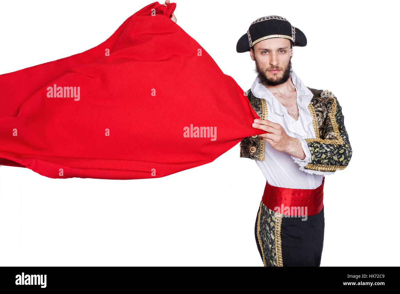 Hombres vestidos como matador sobre un fondo blanco. Retrato de estudio Foto de stock