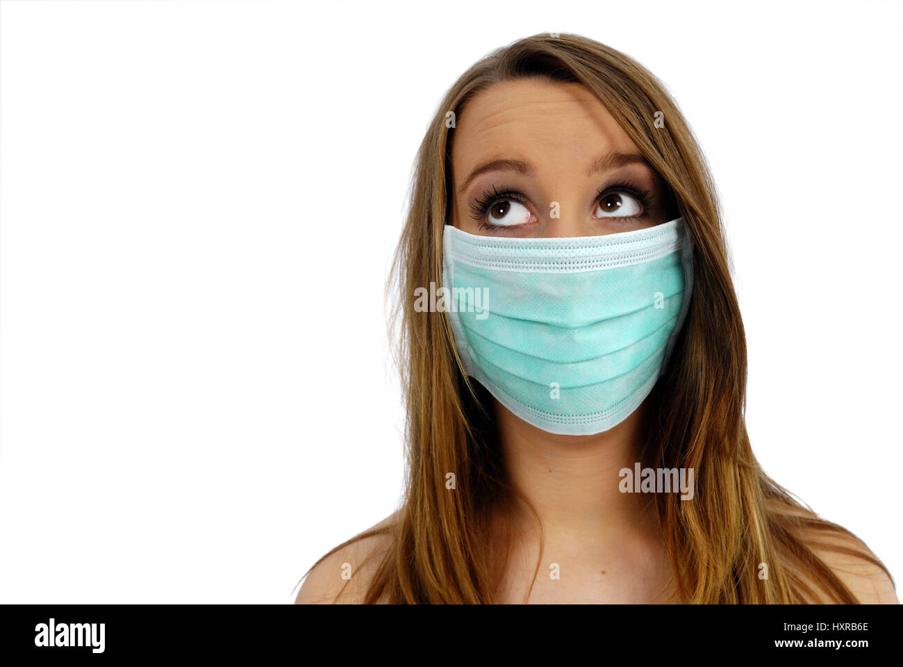 Mujer con máscara de cerdo, gripe, Frau mit Mundschutz, Schweinegrippe Foto de stock