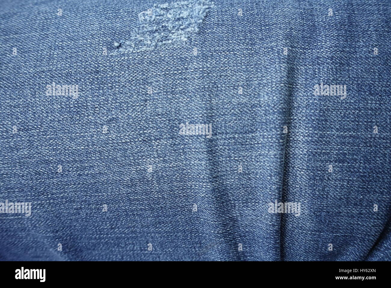 Jeans deshilachados textura de fondo de blue jeans cerrar Foto de stock