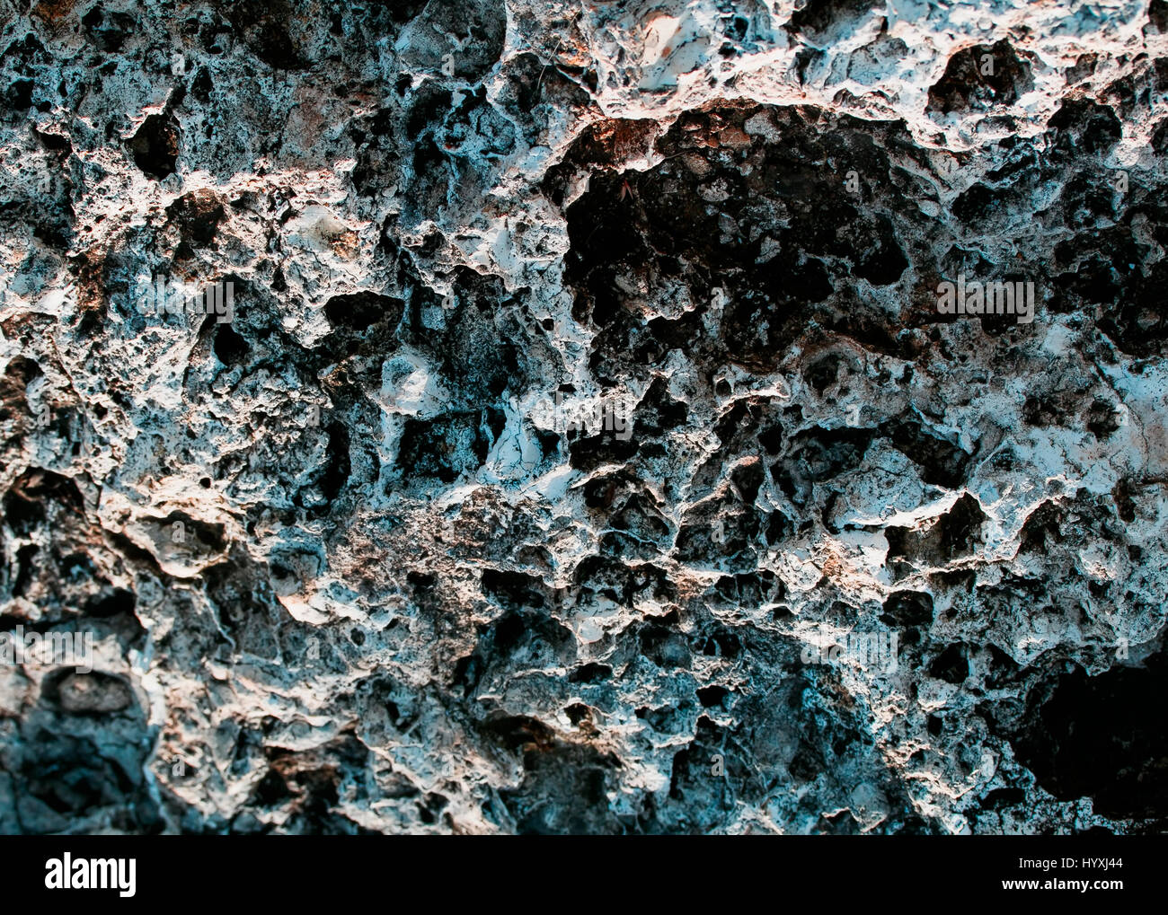 Hermosa textura rugosa de color piedra con diversas fosas y tubérculos Foto de stock
