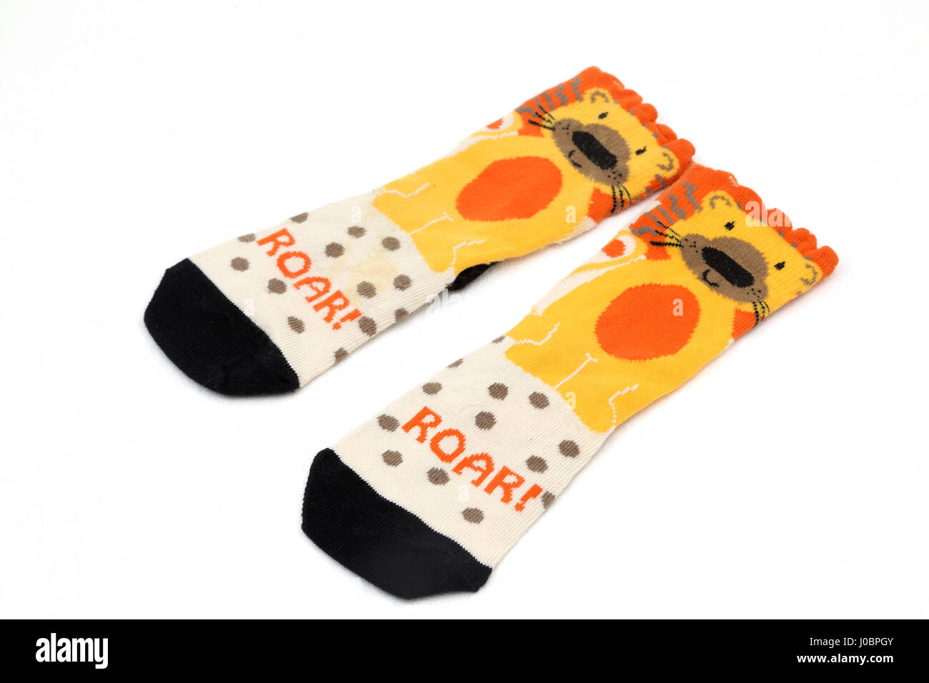 Un par de calcetines del niño un diseño de león Foto de stock