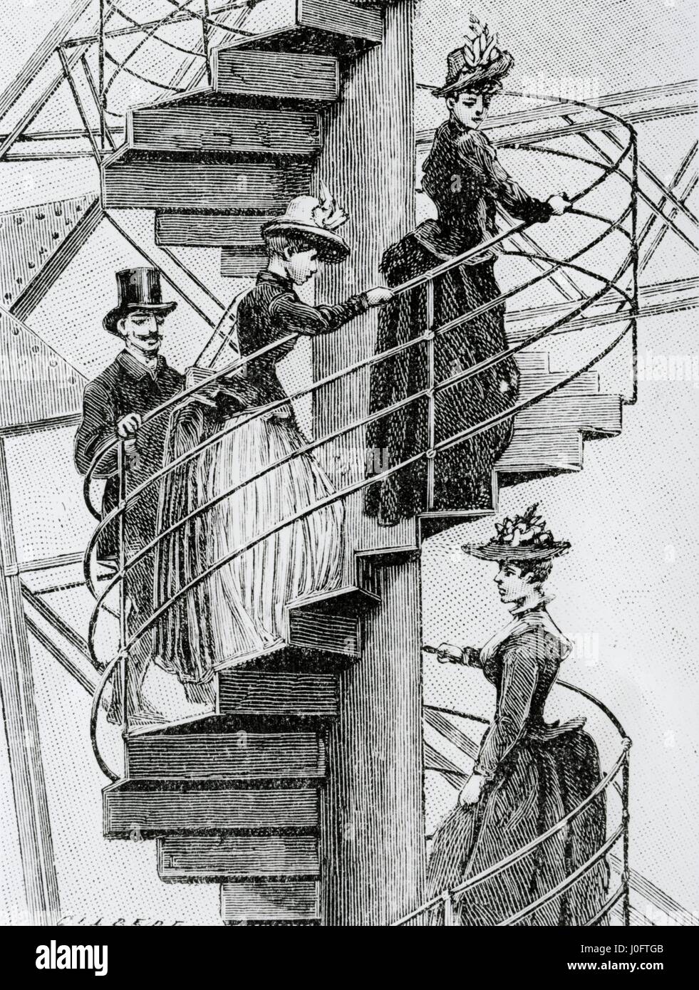 La Torre Eiffel, la gente subiendo la escalera de caracol de la torre Foto de stock
