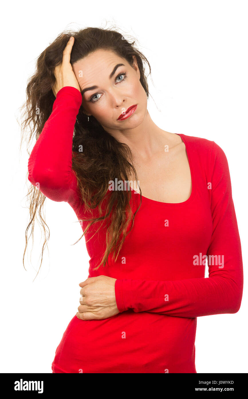 Una infeliz mujer hermosa que está teniendo un mal día de cabello aislado en blanco. Foto de stock