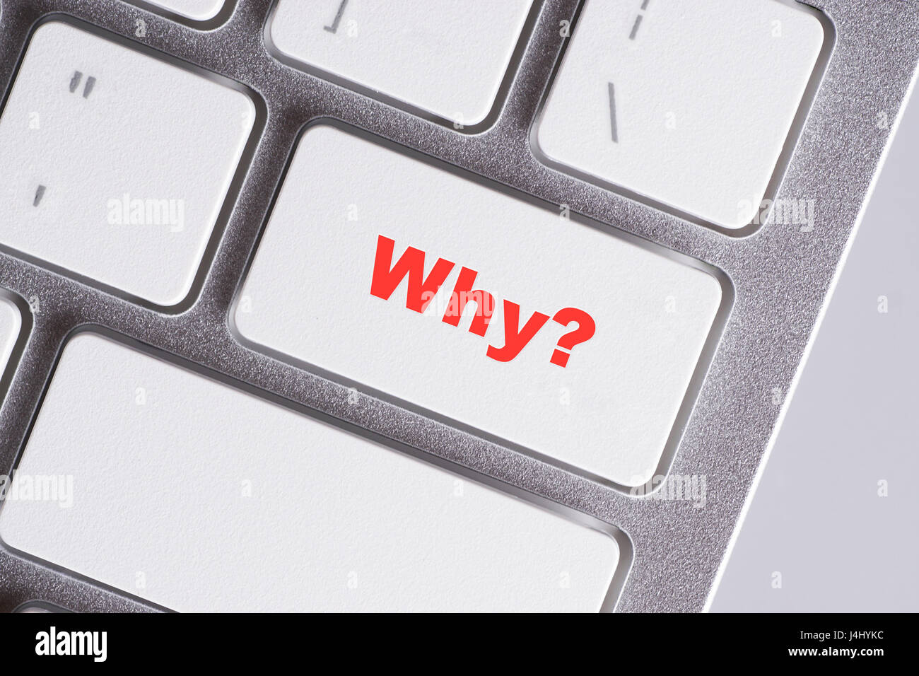 "¿Por qué?" las palabras en rojo white keyboard - online, la educación y el concepto de negocio Foto de stock