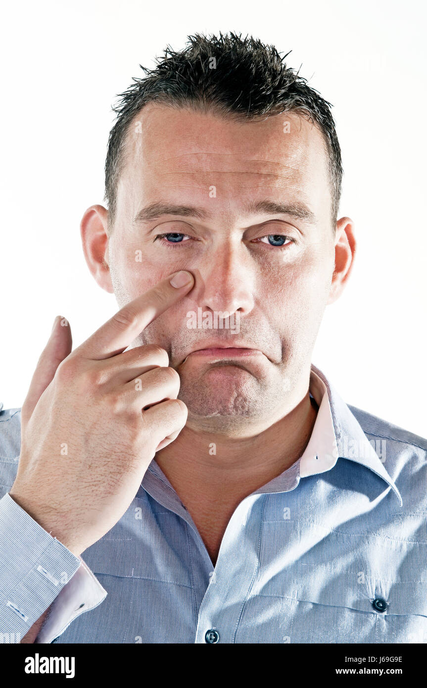 Emociones fisonomía triste mueca infeliz hombre cabeza dedo opcional aislado Foto de stock