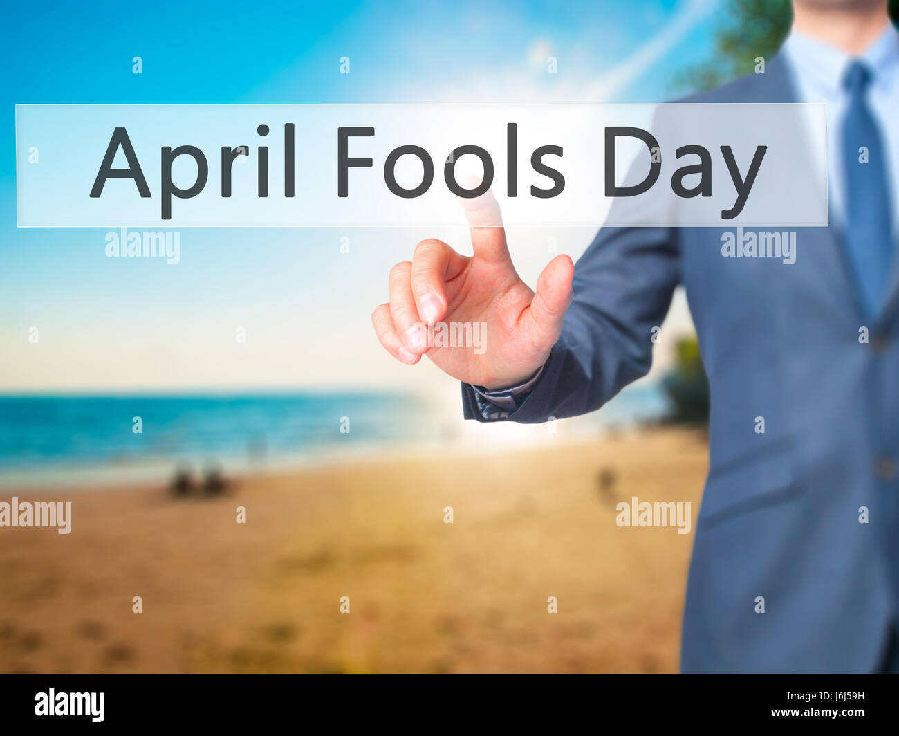 April Fools Day - Empresario pulse en pantalla digital. Concepto de empresa, internet. Stock Photo Foto de stock