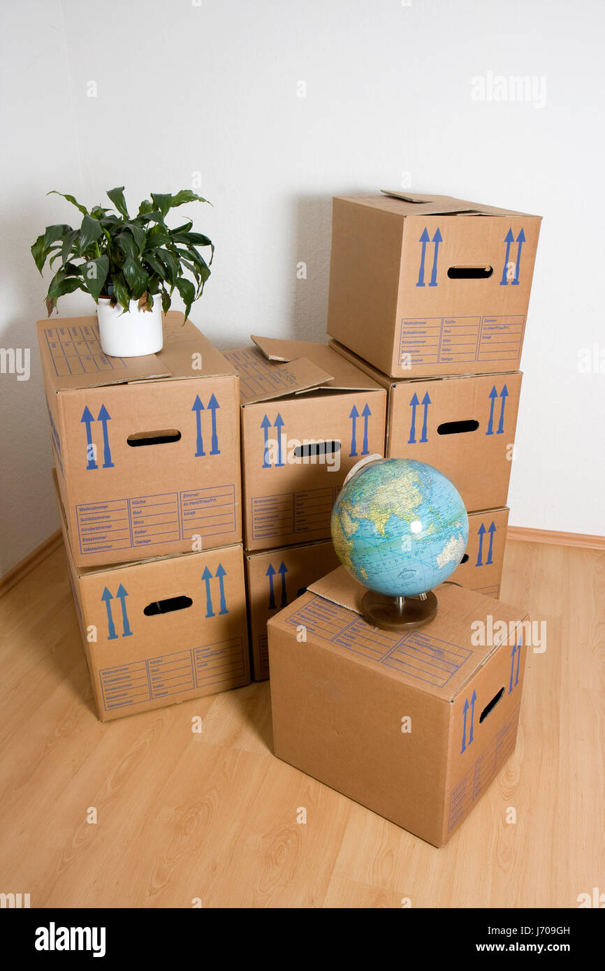 Cajas extracción mundo planeta tierra mundo quitar mover inicio el piso apartamento Foto de stock