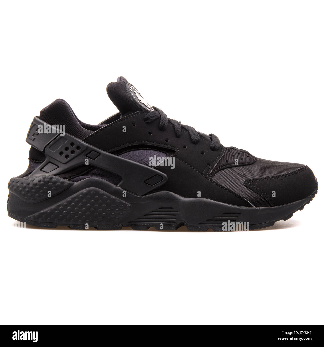 Nike Air Huarache hombres ejecutando Sneakers - 318429-003 Negro Fotografía  de stock - Alamy