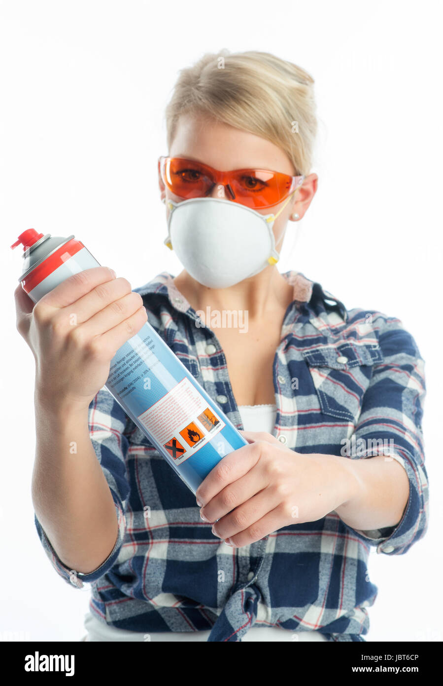 Mujer con spray Foto de stock