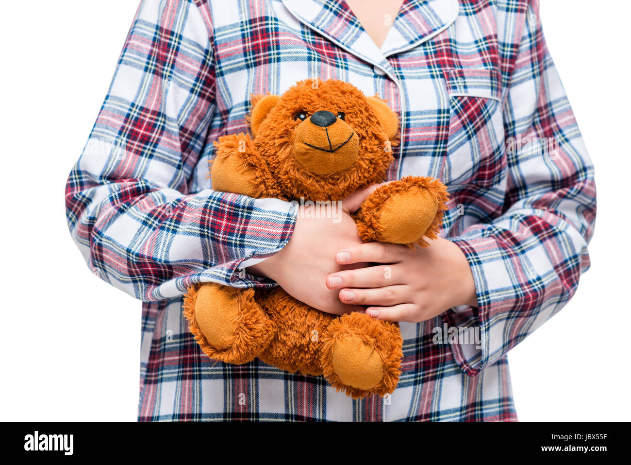 Peluquero Partina City Inmunizar Mujer en el Plaid pijama sosteniendo un oso de peluche marrón en primer  plano Fotografía de stock - Alamy