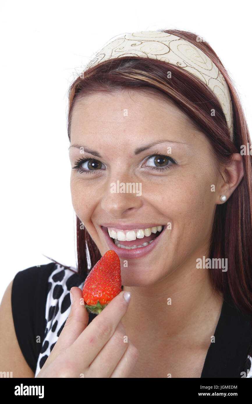 Mujer joven come fresas frescas - Joven come fresa, Junge Frau isst frische Erdbeeren - Joven come fresa Foto de stock