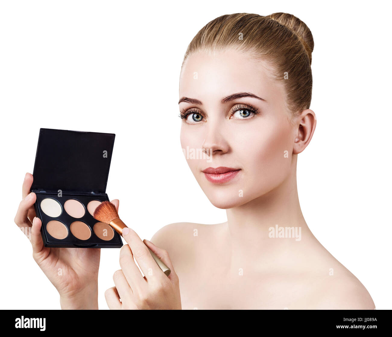 Mujer joven sosteniendo la paleta para perfilar el rostro Fotografía de  stock - Alamy