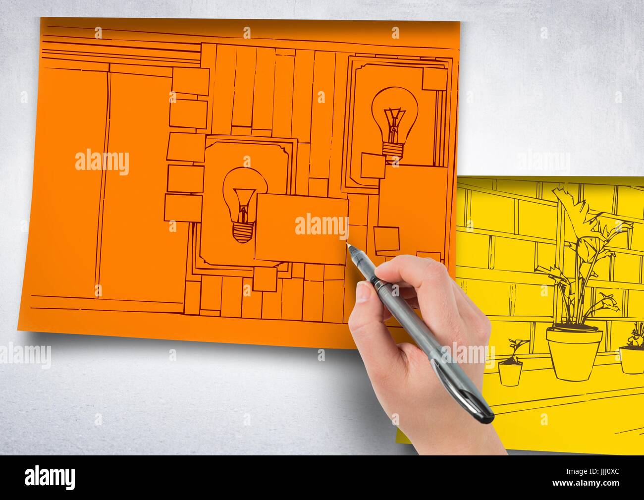 Dibujo a mano alzada, oficina líneas rojas en papel naranja pegar en la pared. 1 blueprint más documentos en amarillo. Foto de stock