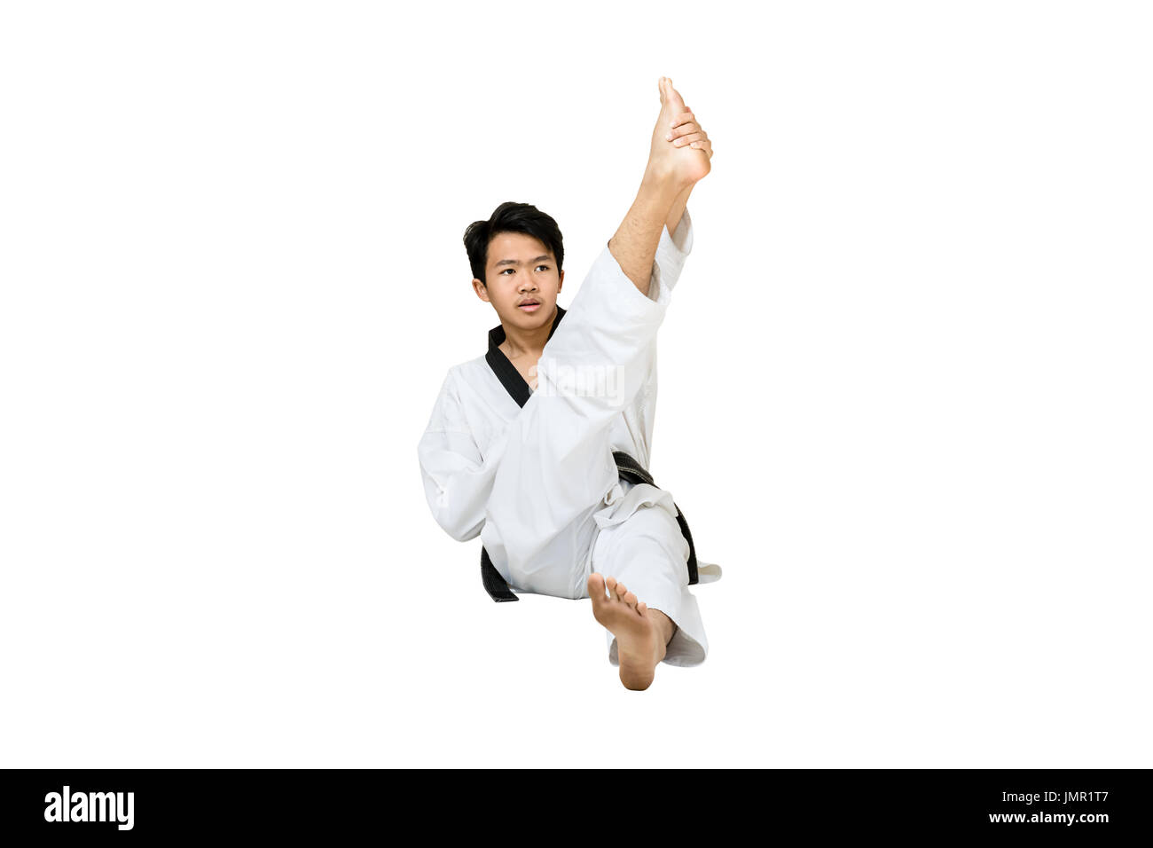 Retrato de una asiática de taekwondo profesional grado de cinturón negro  (Dan) estirando su cuerpo. Longitud completa aisladas sobre fondo blanco  con espacio y copia Fotografía de stock - Alamy