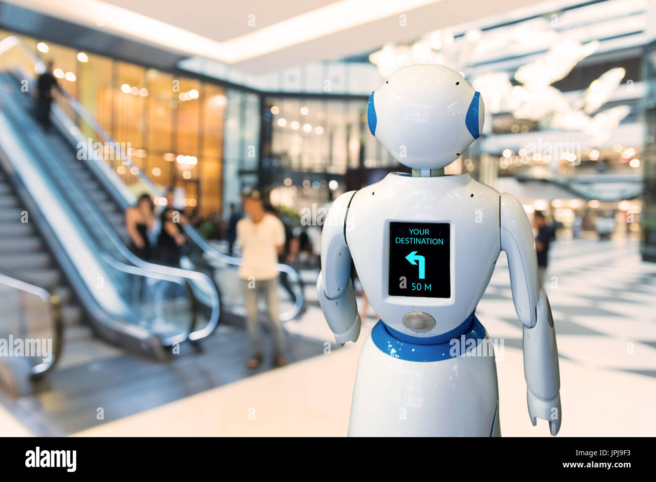 Retail , inteligente robot ayudante , robo advisor tecnología robot de navegación en el almacén. Robot a pie de plomo para guiar al cliente a su destino Foto de stock