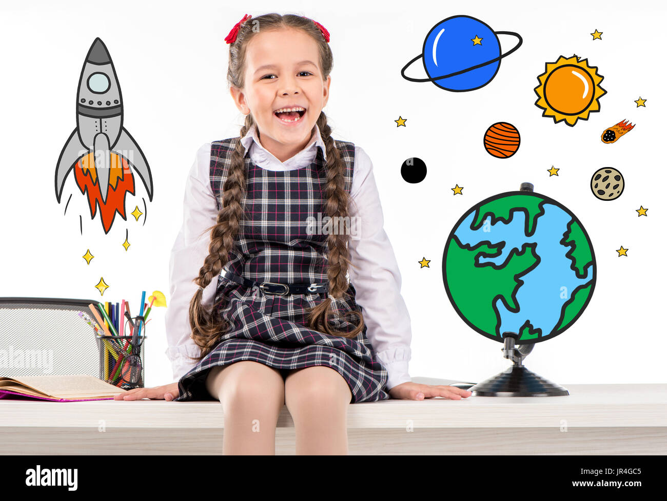 Niña de la escuela soñando con viajes espaciales Foto de stock