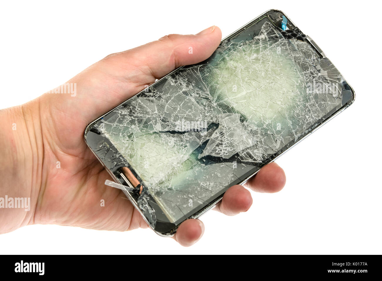 Teléfono móvil con un mal hecha añicos la pantalla después de una grave caída. Foto de stock