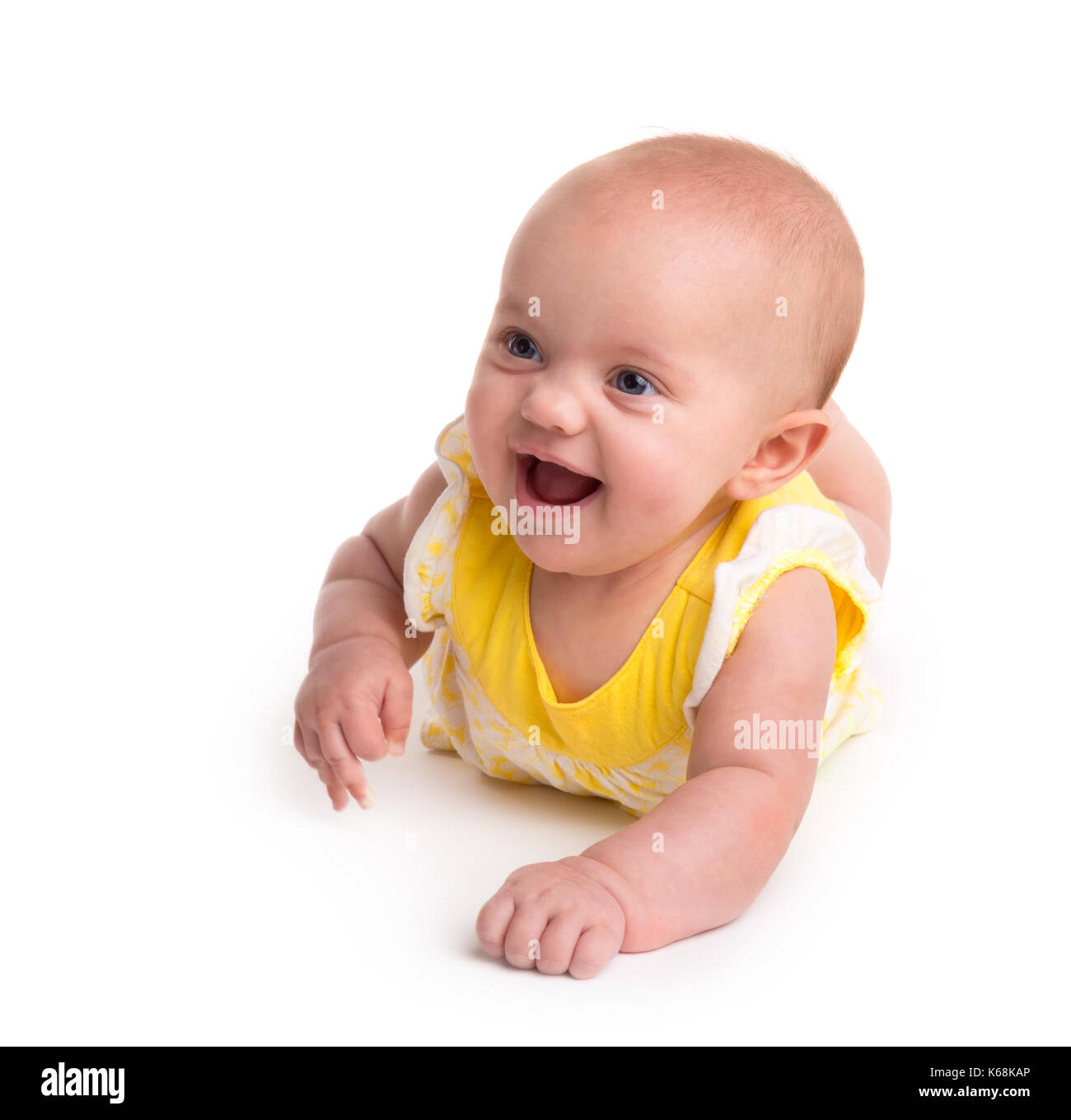 Lindo Bebé sonriendo aislado sobre fondo blanco. Foto de stock