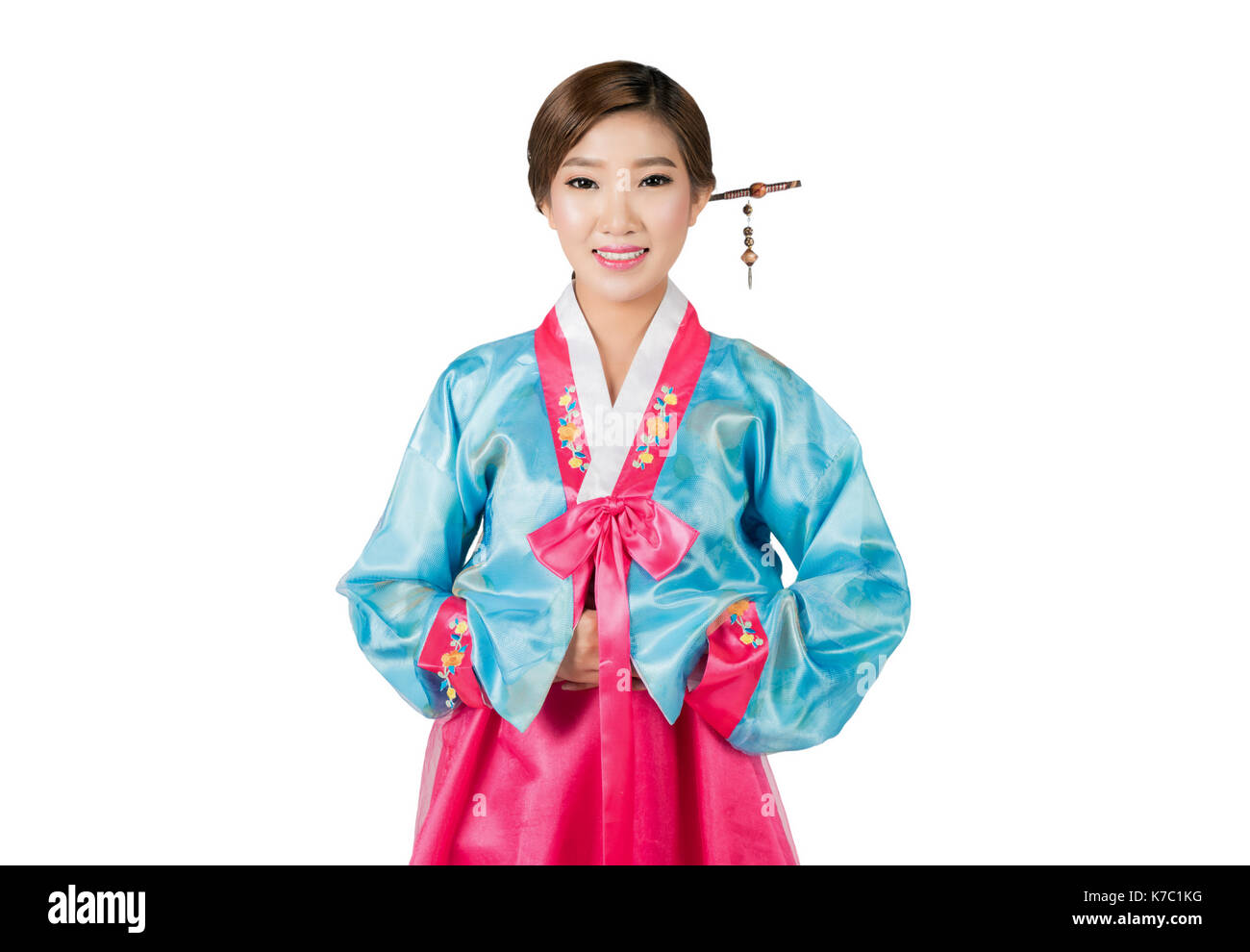 La mujer coreana con hanbok, el traje tradicional coreano en fondo blanco con trazado de recorte. Foto de stock