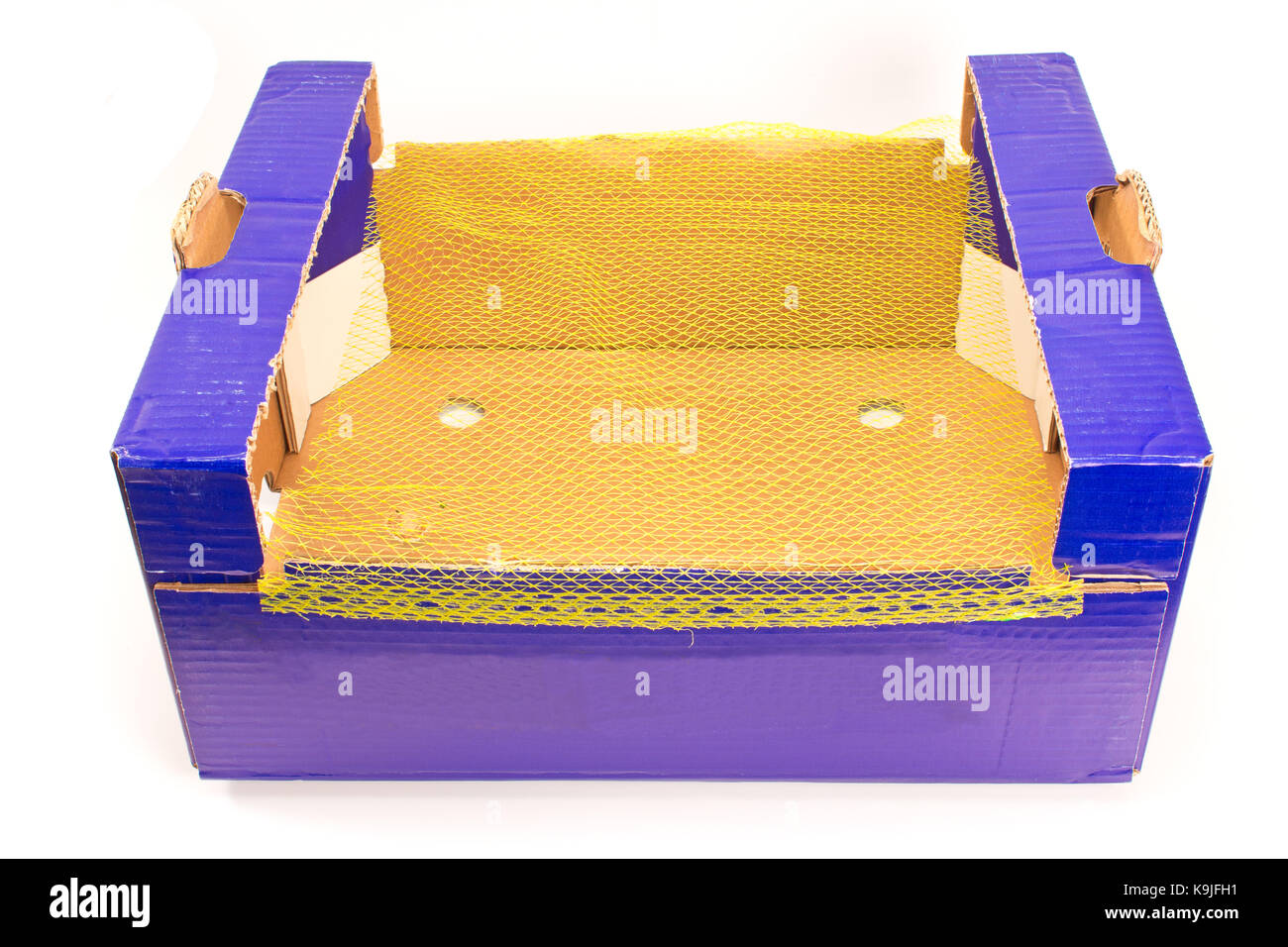 Cajas de cartón para frutas con plástico net Foto de stock