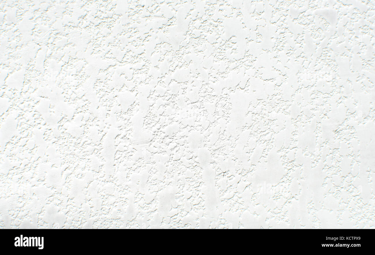 Textura de pared blanca. Pintura blanca de fondo. Salpicaduras blancas de  diferentes tamaños de pintura blanca en la pared Fotografía de stock - Alamy