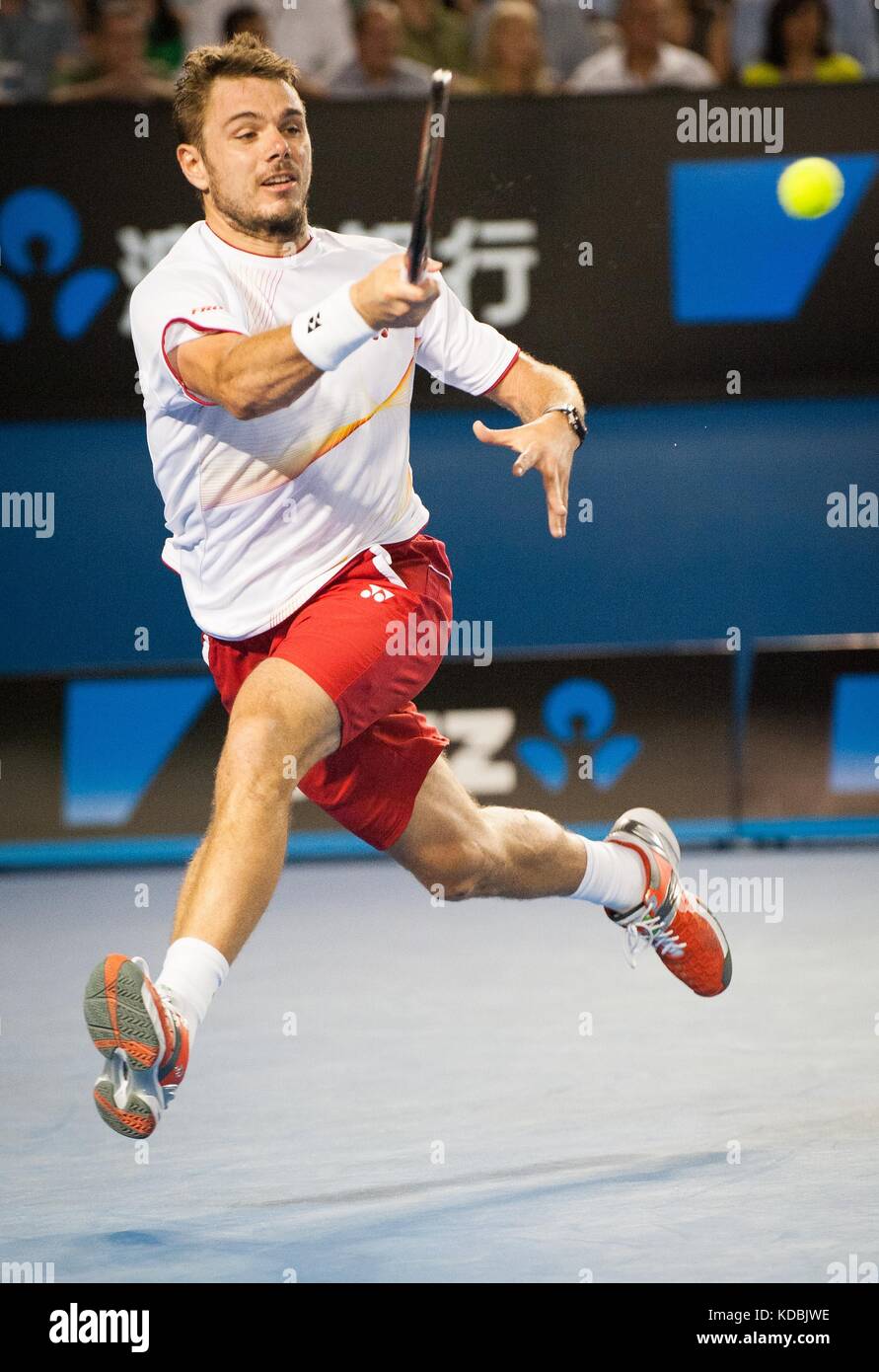 Stanislaus Wawrinka de Suiza derrotó al jugador número uno en el mundo R. Nadal de España para reclamar el 2014 Abierto Australiano de Hombres Singles Champ Foto de stock