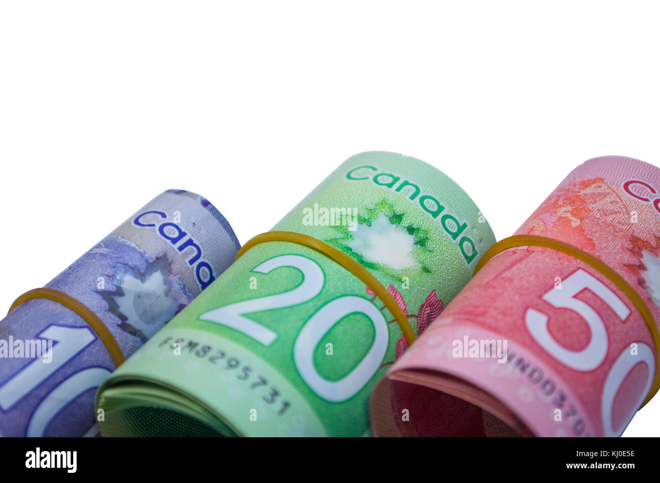 Dólares canadienses en forma de rollo de dinero en blanco fundamentos Foto de stock