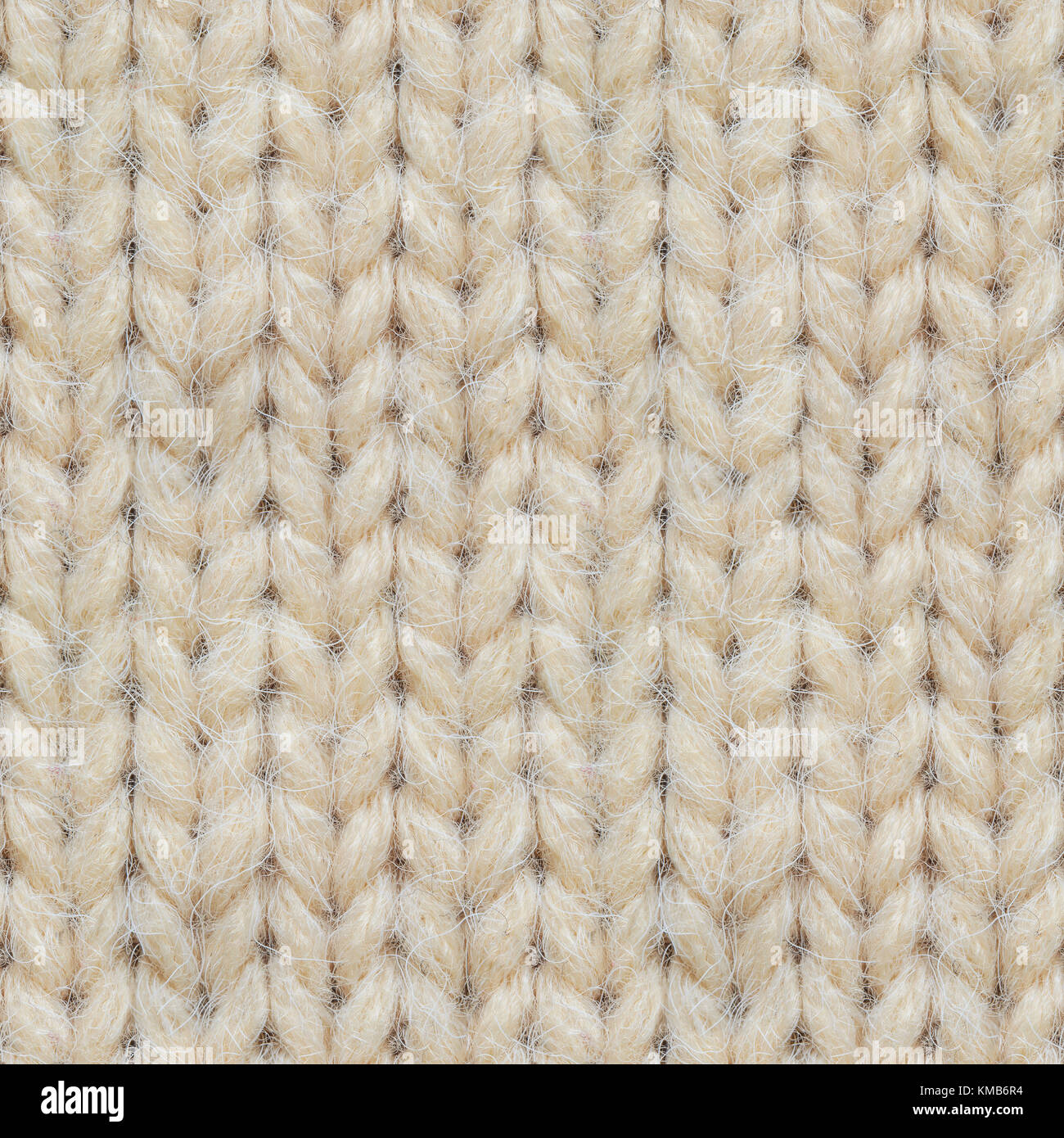 La textura de los tejidos sin costuras Jersey. patrón repetitivo de suéter  tejido color beige Fotografía de stock - Alamy