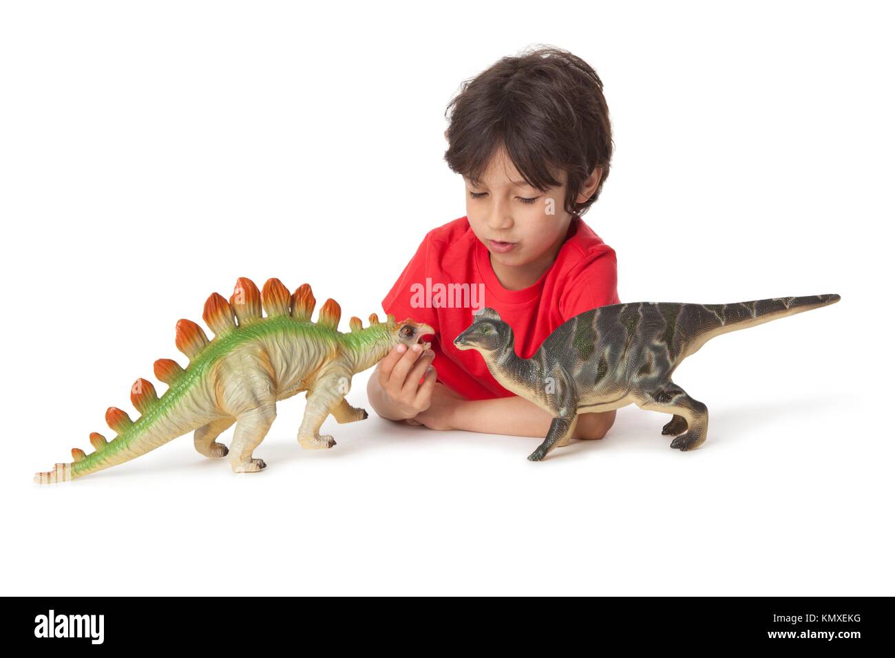 Niño jugando con dinosaurio de juguete Imágenes recortadas de stock - Alamy